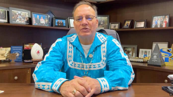 Chief Gary Batton speaking behind his desk.